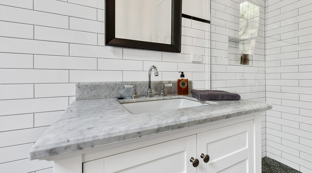 bathroom-vanity-with-black-framed-mirror