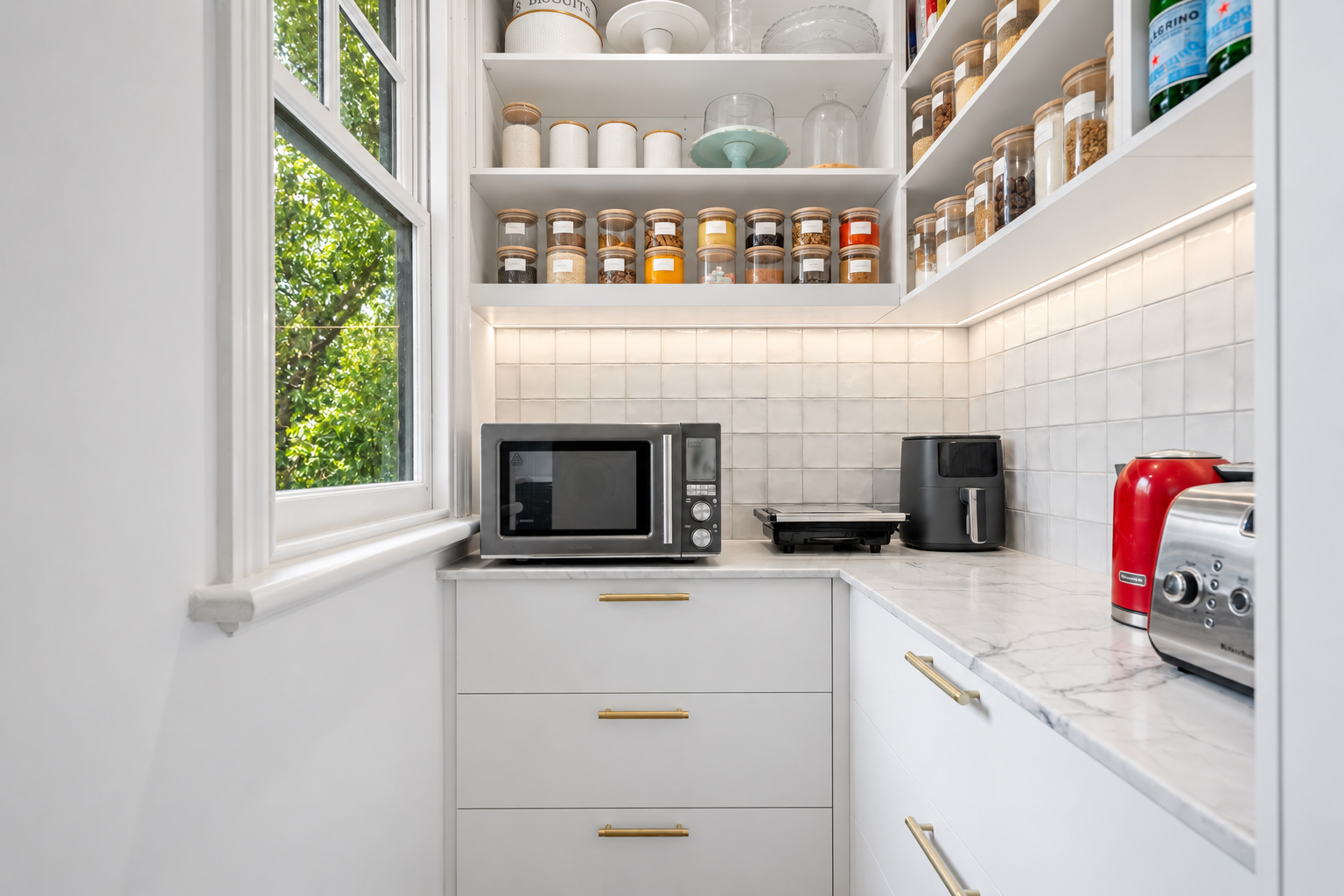 Butler's pantry with Perini splashback tiles and garden views